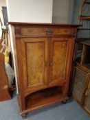 An antique mahogany and walnut double door cabinet , hieght 135 cm, width 90 cm, depth 45 cm.