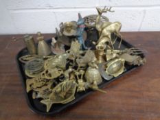 A tray of assorted brass ware - horse brasses, grinder, trivet,