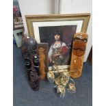 A gilt framed print of a girl with flowers, three carved wooden panels,