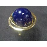 A large gemstone globe on brass stand, height 48 cm.