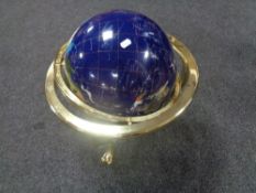 A large gemstone globe on brass stand, height 48 cm.