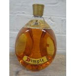 A vintage bottle of dimple old blended Scotch whisky,