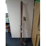 A set of vintage Geilo Sport skis and a pair of bamboo shaft ski poles