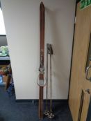 A set of vintage Geilo Sport skis and a pair of bamboo shaft ski poles