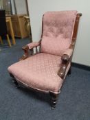 A Victorian mahogany gent's armchair in pink classical fabric