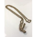 A 9ct gold pharaoh's head pendant on belcher-link chain, chain length 61cm.