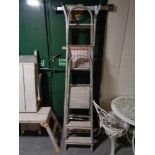 Two sets of folding aluminium step ladders together with a multi function folding aluminium ladder