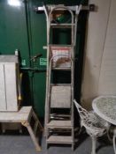 Two sets of folding aluminium step ladders together with a multi function folding aluminium ladder