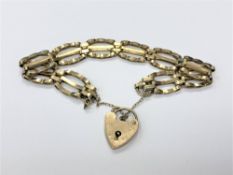 A 9ct gold padlock bracelet CONDITION REPORT: 11.