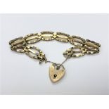 A 9ct gold padlock bracelet CONDITION REPORT: 11.