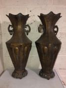 A pair of metal oriental twin handled vases,