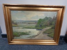 A 20th century continental school gilt framed oil on canvas, rowing boat at river side, signed T.E.