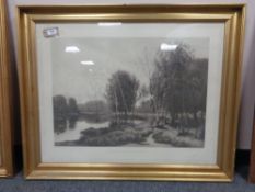 An early twentieth century monochrome engraving depicting a lake scene in gilt frame
