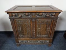 A profusely carved oak blanket chest fitted with a drawer, height 84 cm, width 88 cm, depth 49 cm.