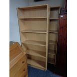 A pair of pine effect office bookshelves