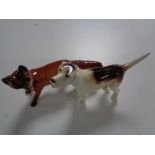 Three Beswick figures, fox and two hounds,