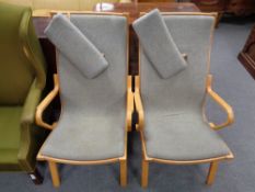 A pair of 20th century beech framed armchairs in grey fabric