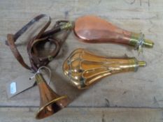 Two copper and brass powder flasks,