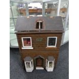 A mid 20th century doll's house titled 'Clayton House',