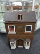 A mid 20th century doll's house titled 'Clayton House',