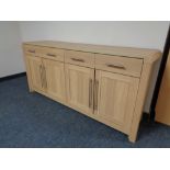 An oak effect four drawer four door sideboard (dimensions 170 cm x 80 cm x 45 cm)