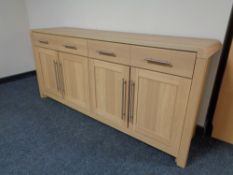 An oak effect four drawer four door sideboard (dimensions 170 cm x 80 cm x 45 cm)