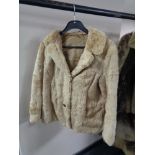 A lady's white ermine fur jacket