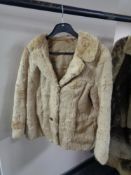 A lady's white ermine fur jacket