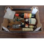 A box of assorted alcohol to include whisky, brandy, Jack Daniels,