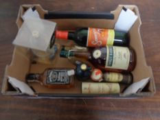 A box of assorted alcohol to include whisky, brandy, Jack Daniels,