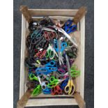 A box of a large quantity of scissors