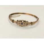A late Victorian sapphire and diamond set rose gold bangle CONDITION REPORT: