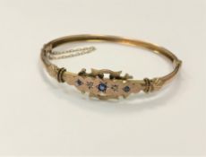 A late Victorian sapphire and diamond set rose gold bangle CONDITION REPORT: