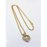 A 9ct gold diamond set heart pendant on chain, chain 40cm. CONDITION REPORT: 7.