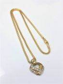 A 9ct gold diamond set heart pendant on chain, chain 40cm. CONDITION REPORT: 7.