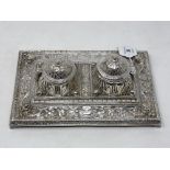 An ornate silver plated desk stand