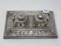 An ornate silver plated desk stand