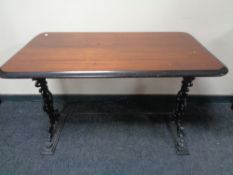 A 20th century rectangular bar table on cast iron legs