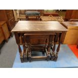 A nest of three oak tables