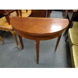 A 19th century mahogany D-shaped turnover top table