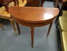 A 19th century mahogany D-shaped turnover top table