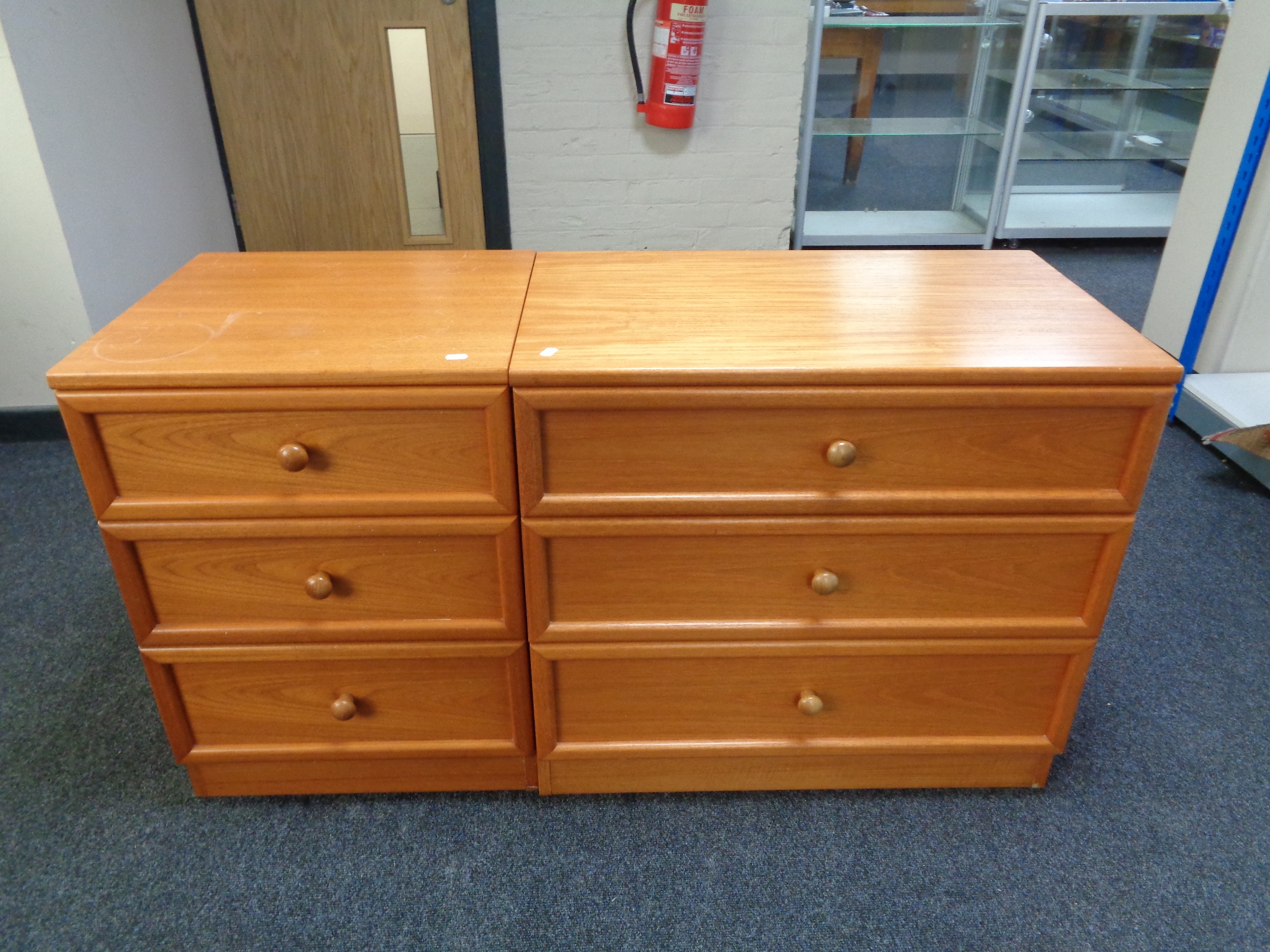 A teak G Plan three drawer chest and matching beside chest