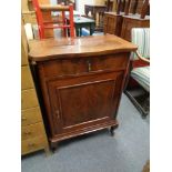 An antique mahogany cabinet fitted a drawer on raised legs