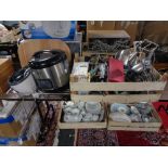 A crate of plated wares, cutlery, candle holders,