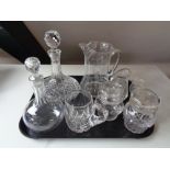 A tray of assorted glass ware to include ship's decanter, glass water jug,