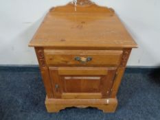 A pine bedside cabinet fitted a drawer