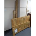 A mango wood 4' 6" bed frame