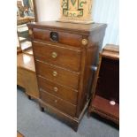 A 19th century narrow oak six drawer chest