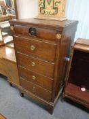 A 19th century narrow oak six drawer chest