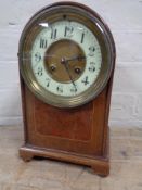 An Edwardian dome top mantel clock with brass and enamel dial CONDITION REPORT: